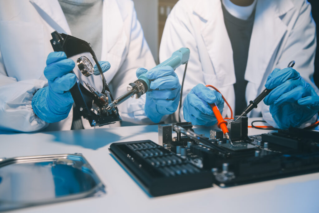 Close up of Technician measuring voltage electronic circuit boar